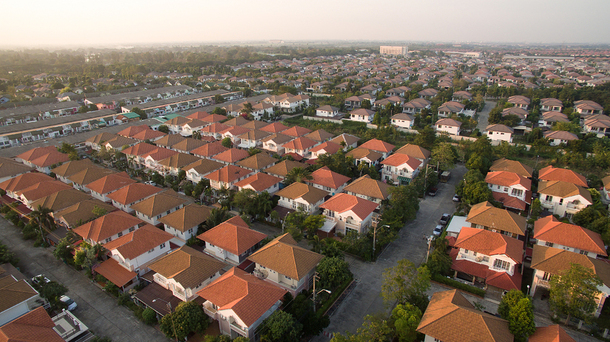 Footage of a neighborhood taken from the sky.