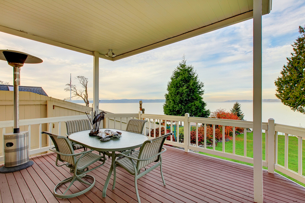 Outside deck with awning and dining table.