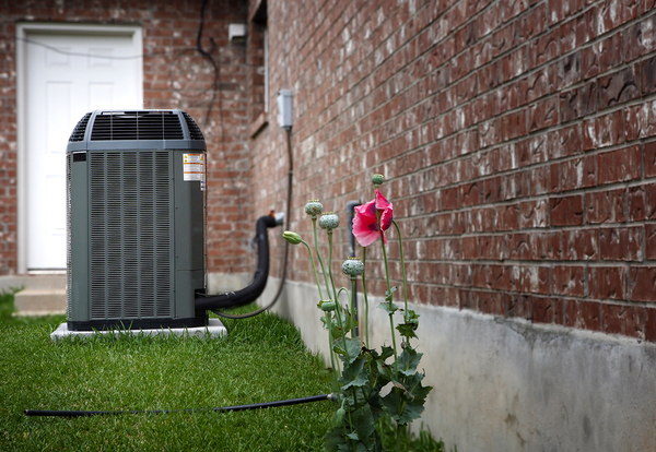 AC unit outside a brick building.