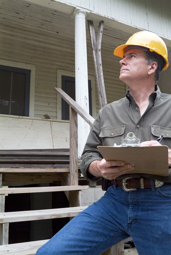 Home inspector looking at a home.