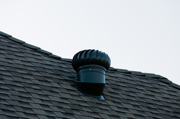 Roof top with shingles and a vent.