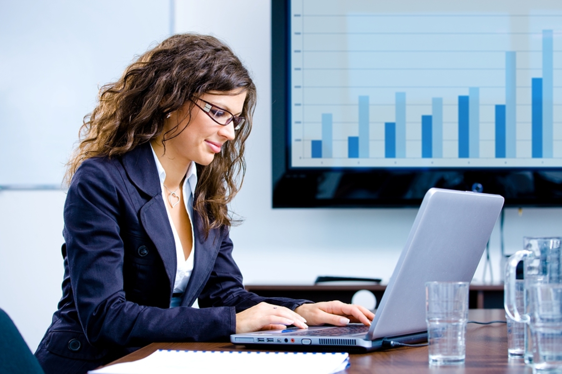 Woman typing on a laptop computer. Woman typing on a laptop computer.