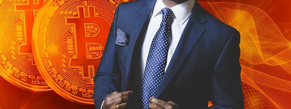 Man in a business suit with bitcoin symbols in the background