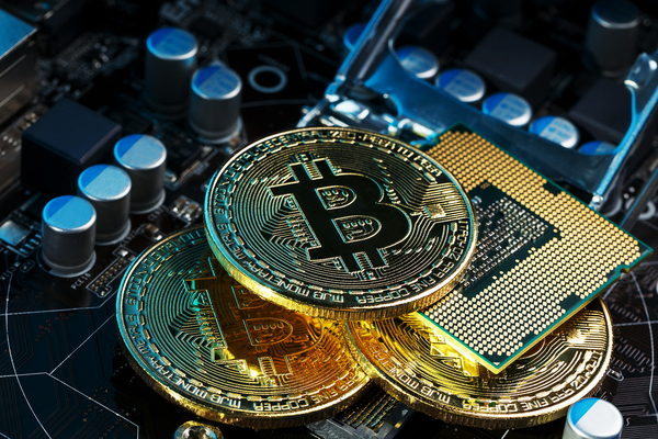 Gold coins with bitcoin symbol.