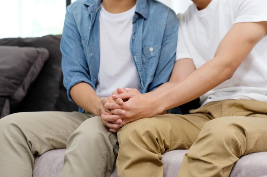 Couple holding hands.