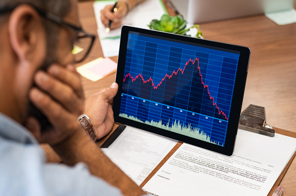 Person looking at a data graph on a tablet.