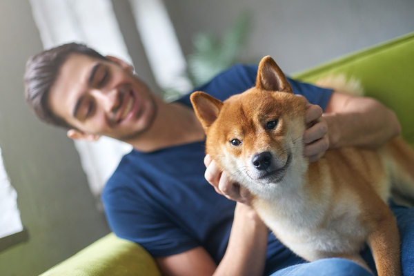 Man holding his dog.