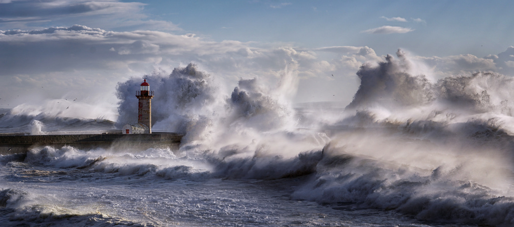 Lighthouse with giant waves.