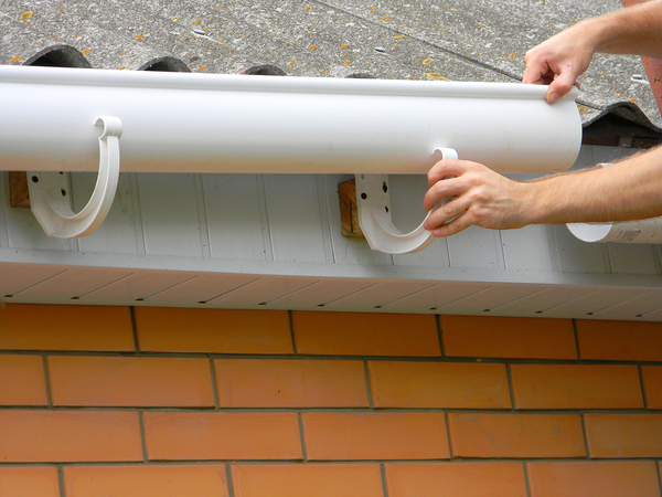 Installing gutters.