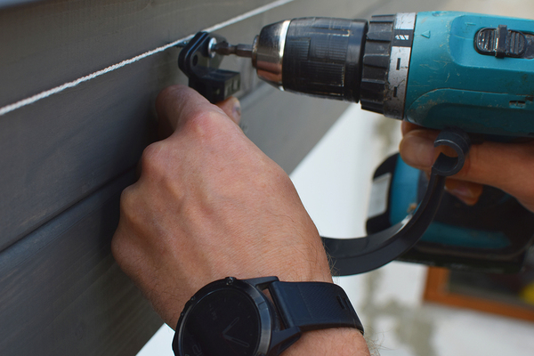 Installing siding.