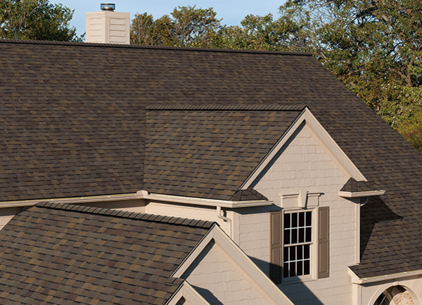 Brown shingles on a house.