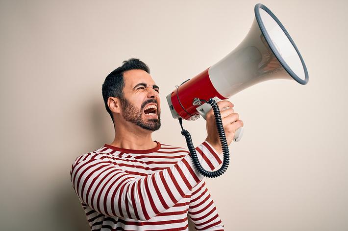 Man shouting into a megaphone.