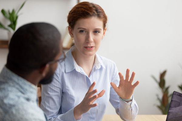 Woman discussing innovation with a colleague.