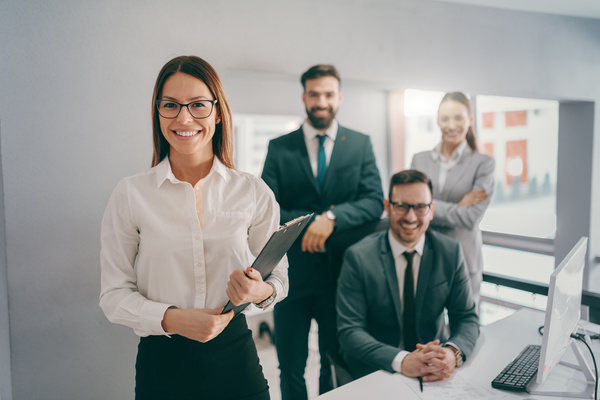 Smiling group of colleagues - data integrity