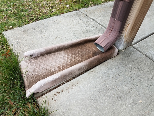 Gutter splash block.