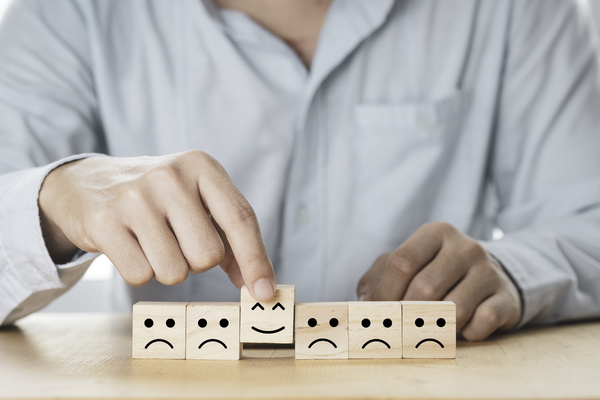 information relevance - smilely face wooden block.