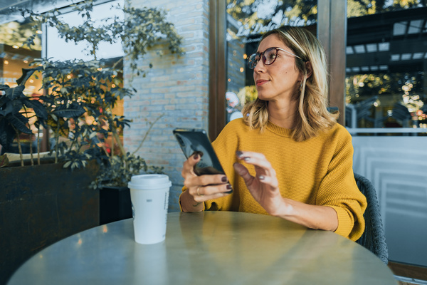 Woman drinking a cup of coffee.