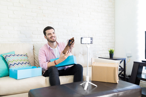 Person holding a newly bought shoe.