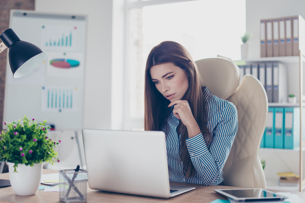 Woman working at her desk. Data strategy