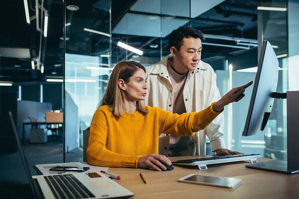 Two colleagues having a discussion. IBM Mainframe