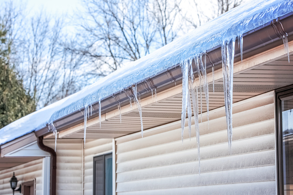 Ice and icicles on top of gutters.