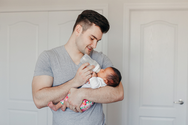 Father feeding his baby.