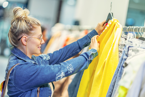 Woman shopping for a rain coat.