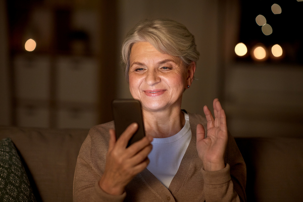 Smiling woman looking at her phone.