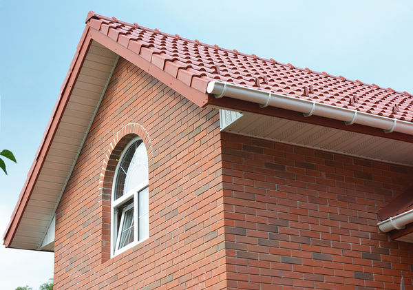 Brick house with tile roof.