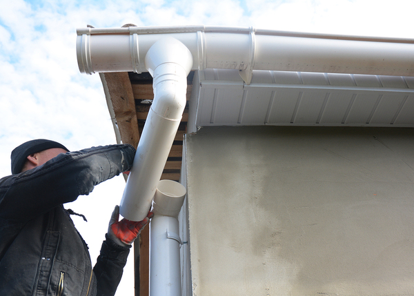 Man repairing a drain pipe.