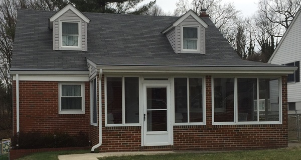 Brick front home with covered porch.