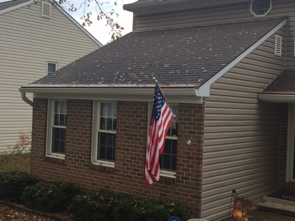 Brick home with an American Flag.