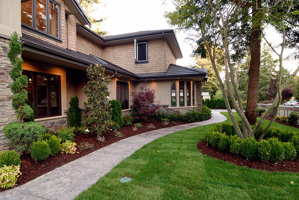 Tan colored home with brown gutters and roof.