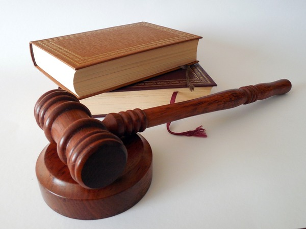 Books on a table and a gavel.