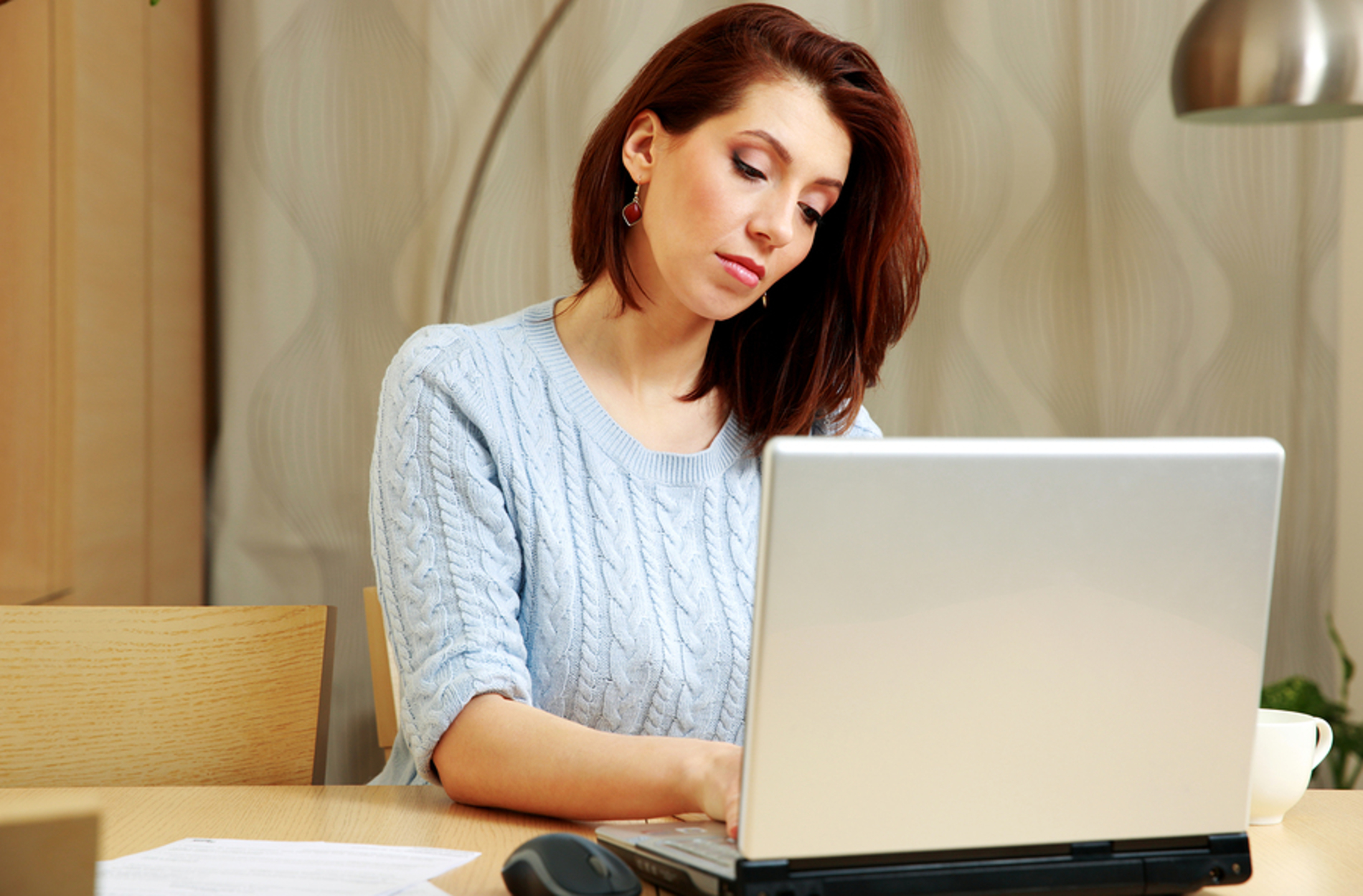 Woman typing on her laptop computer. Woman typing on her laptop computer.