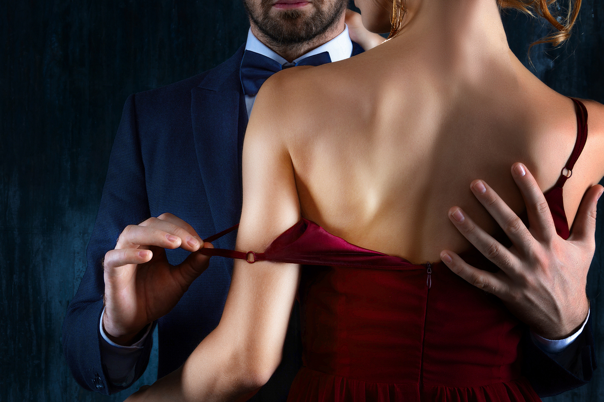 Man in a suit and woman in an evening dress.