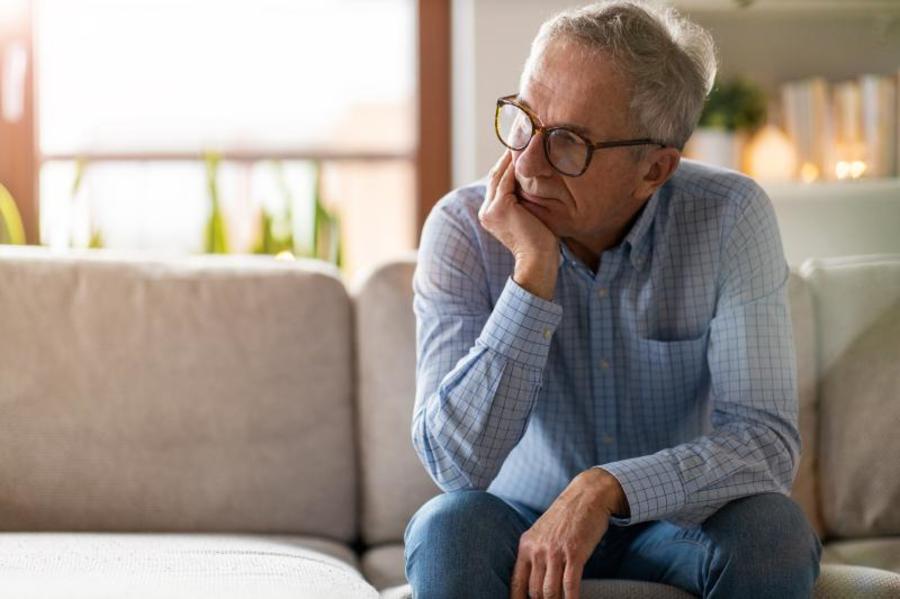 Man sitting on the couch.