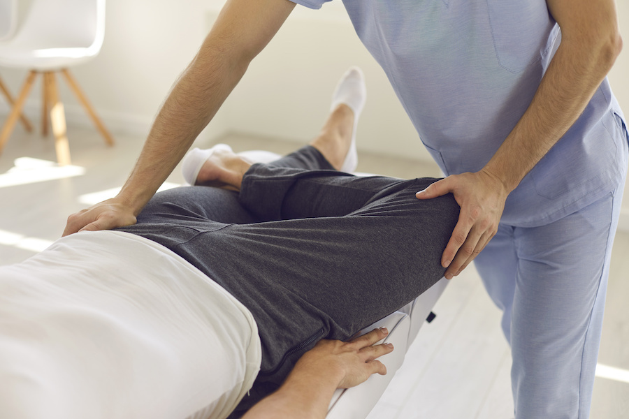 Physical therapist working with a patient.