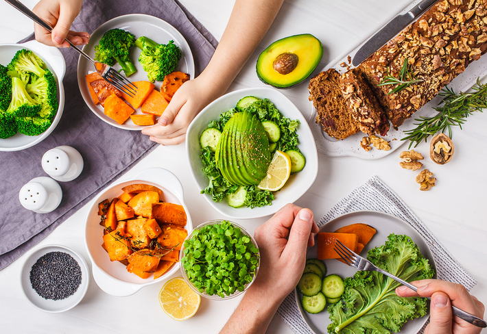 Table filled with vegetable dishes.