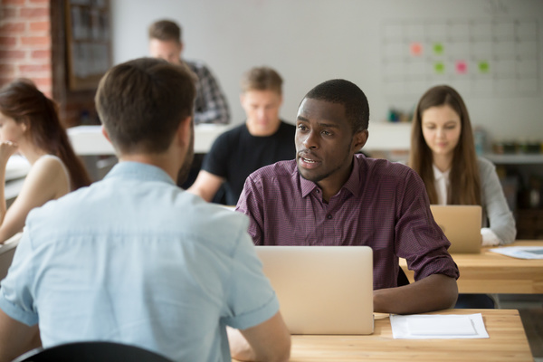 Colleagues having a discussion.