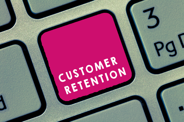 Computer keyboard key labeled customer retention
