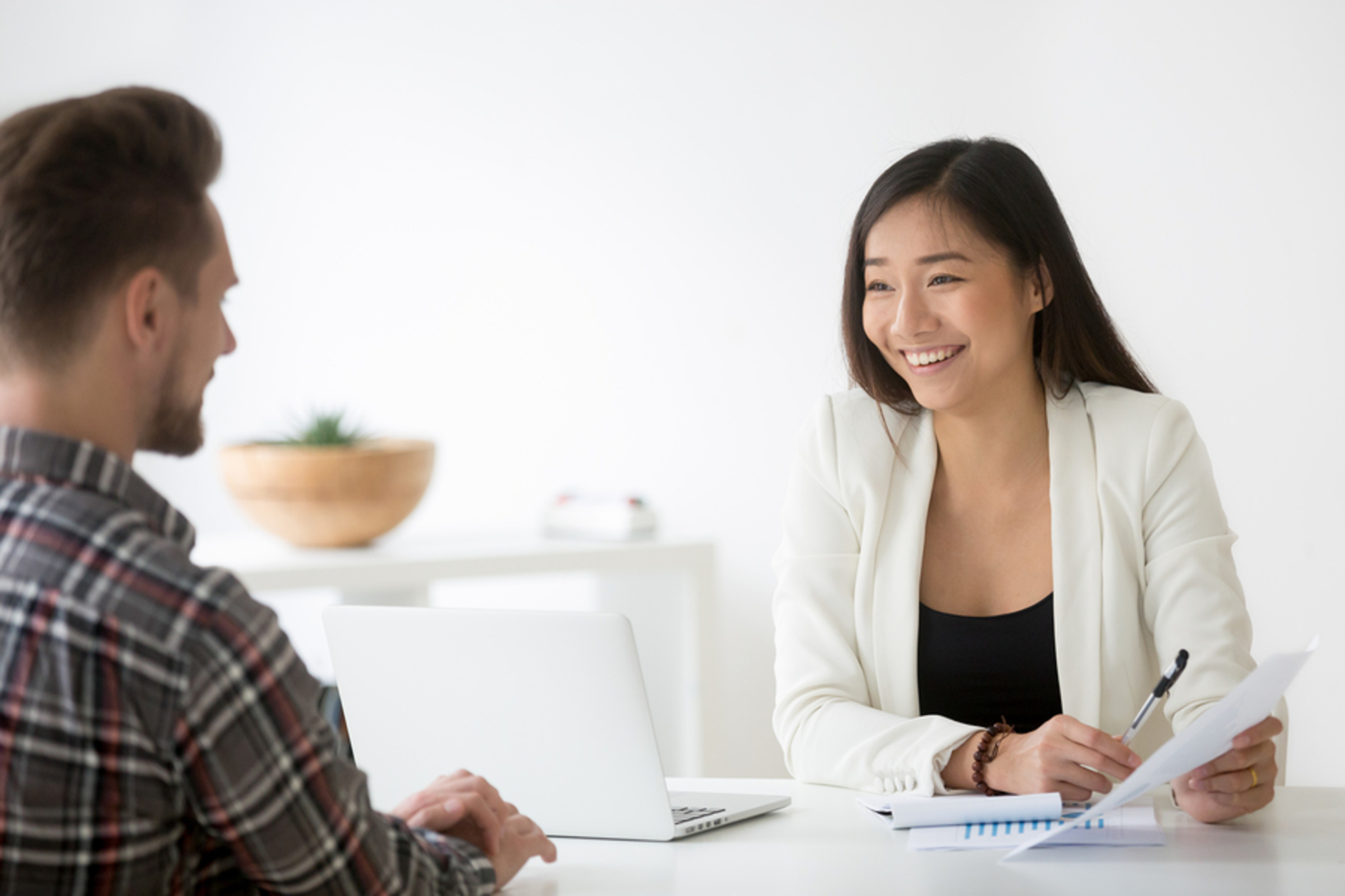 Customer discussing feedback with a business owner. Customer discussing feedback with a business owner.