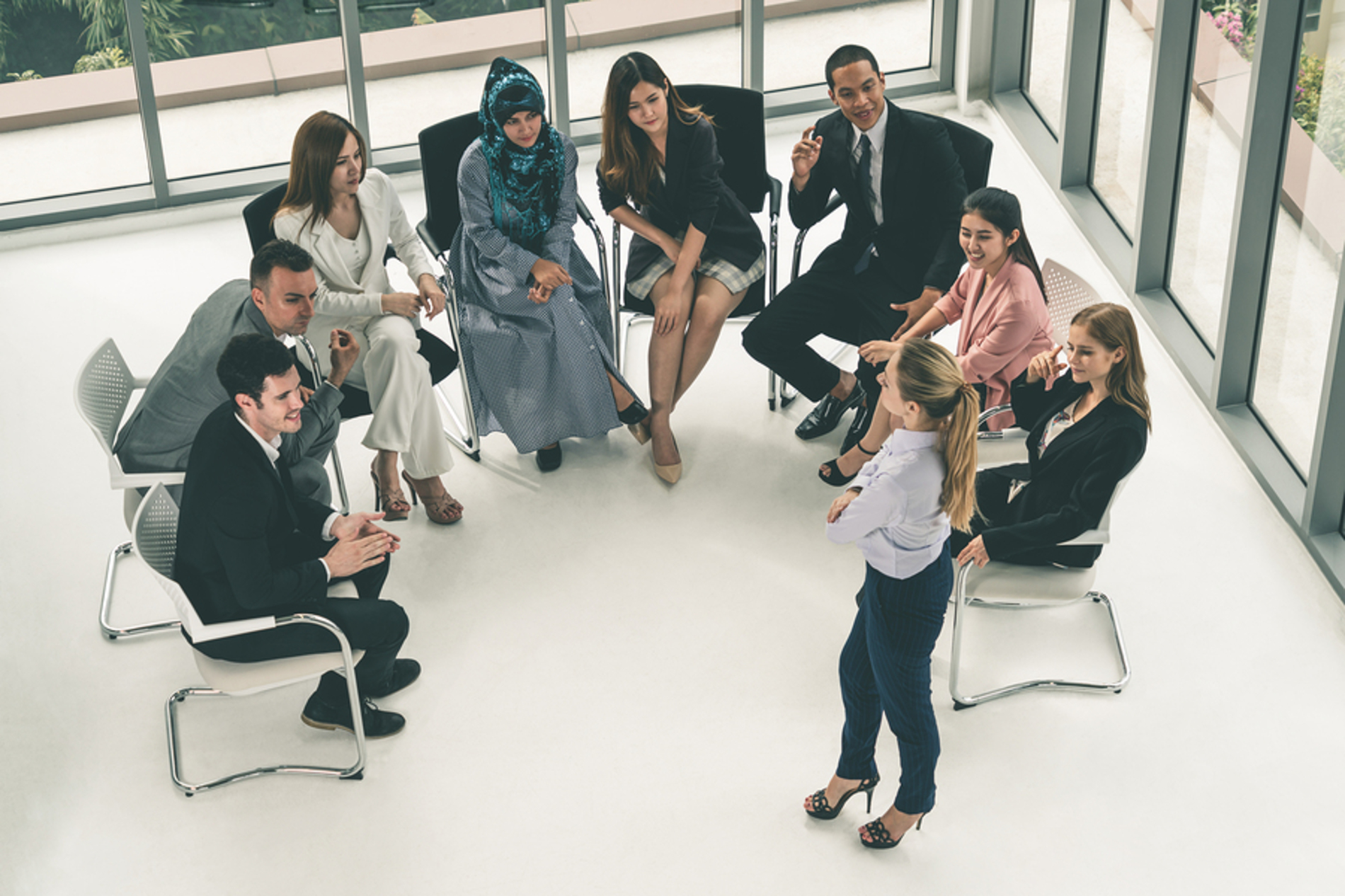 Group of employees having a discussion. Group of employees having a discussion.