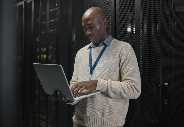 Man at work using a laptop. Moving to the cloud