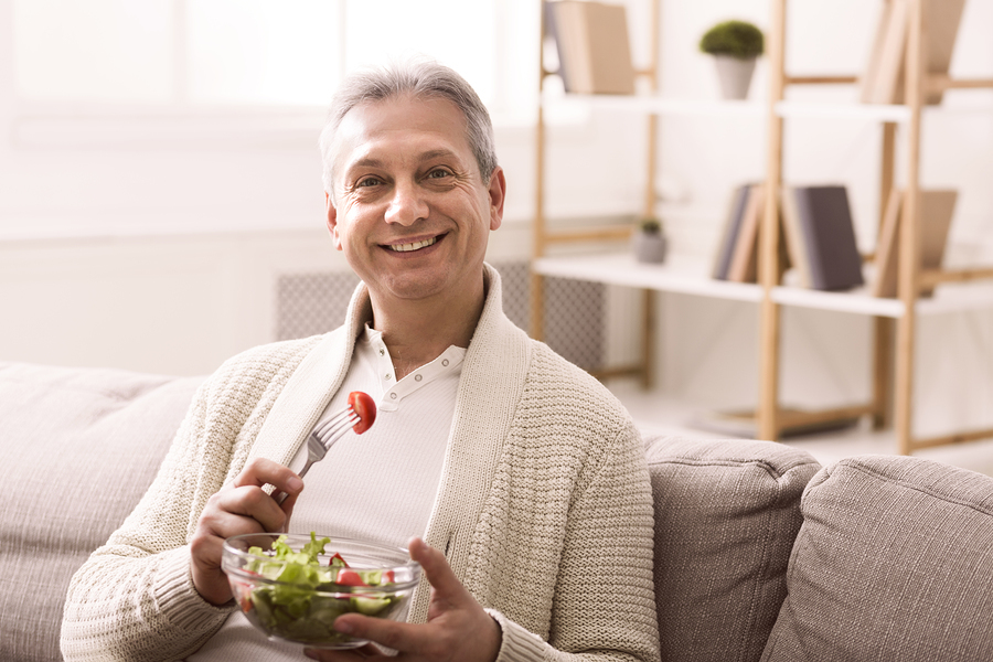 Man eating a health salad.