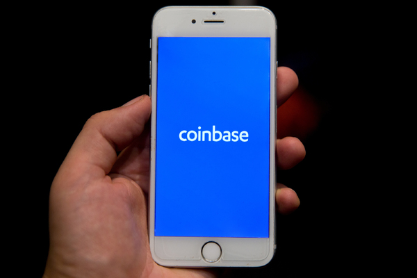 Mobile phone with coinbase app displayed.