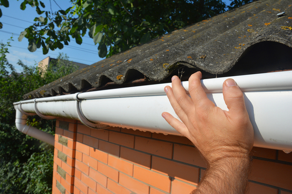 Person placing a gutter.