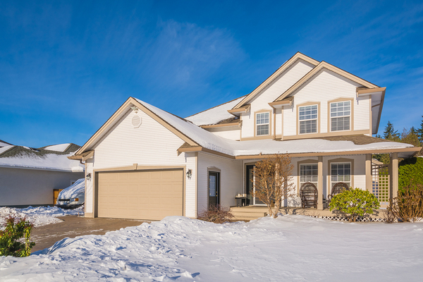 Home in the winter with a one car garage.