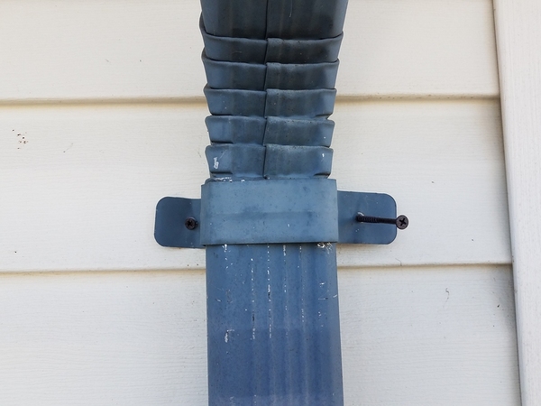 Gutter attached to downspout.