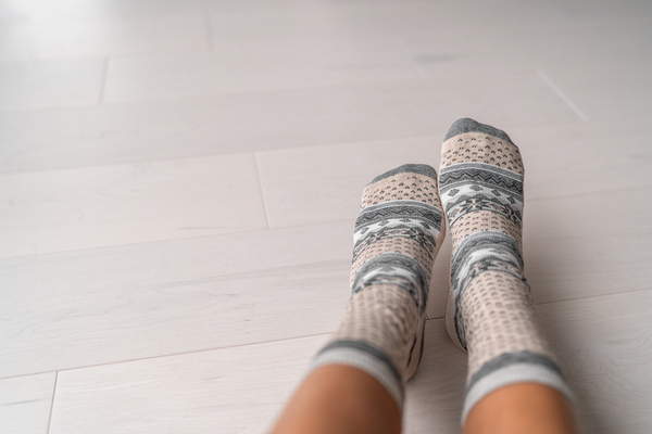 Person wearing patterned socks.